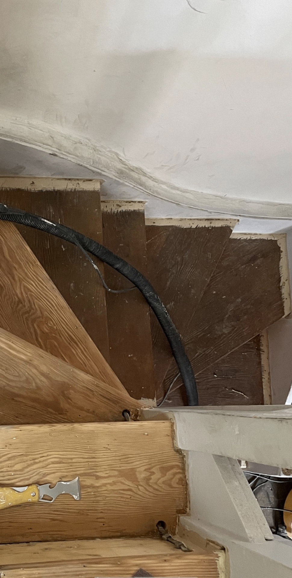 Worn pine staircase before restoration